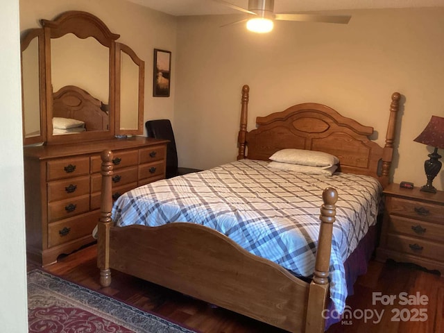 bedroom featuring dark hardwood / wood-style floors and ceiling fan