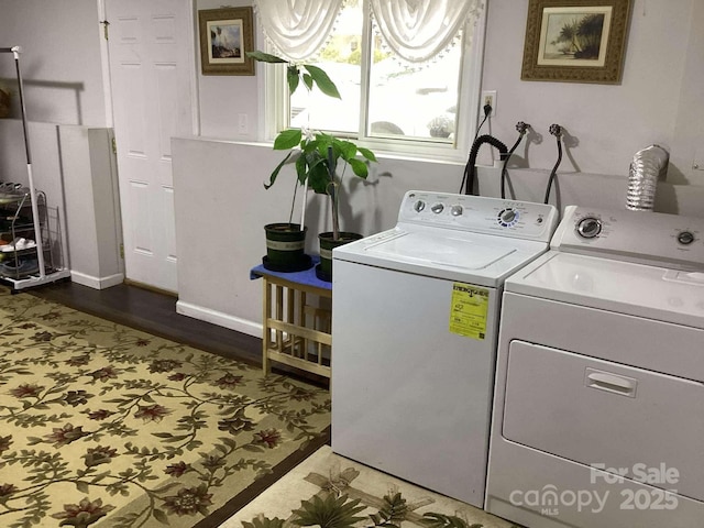 laundry area with independent washer and dryer