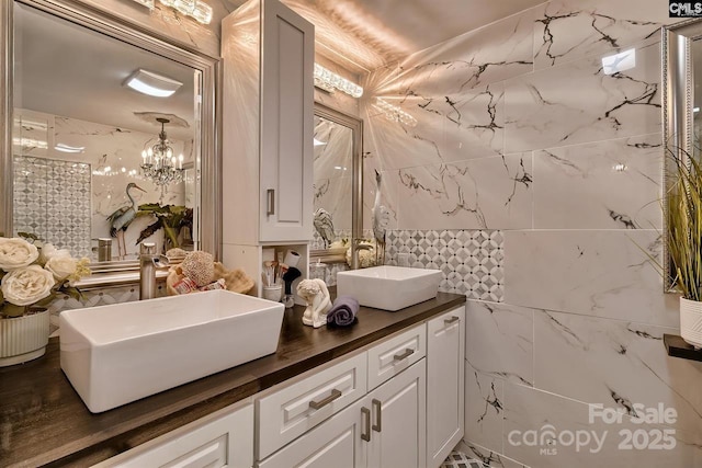 bathroom featuring double vanity, tile walls, and a sink