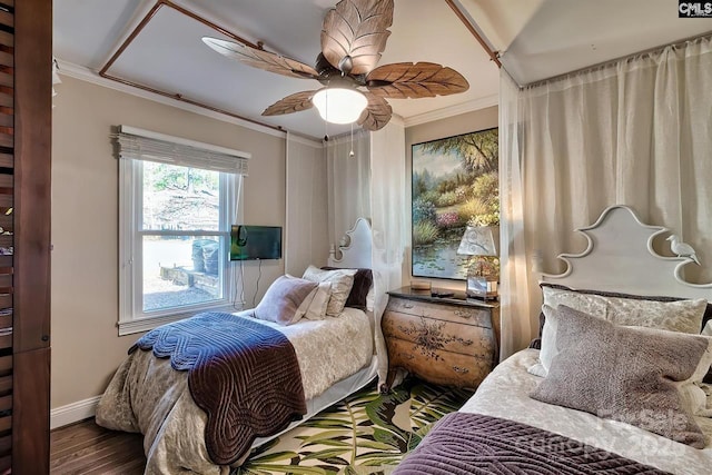 bedroom featuring ceiling fan, crown molding, baseboards, and wood finished floors