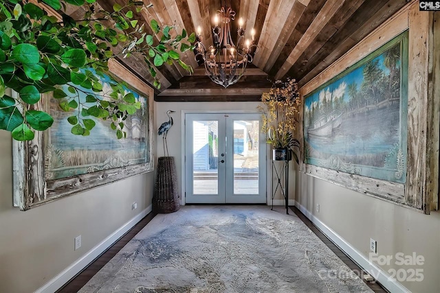 doorway to outside with a chandelier, french doors, wood ceiling, and baseboards