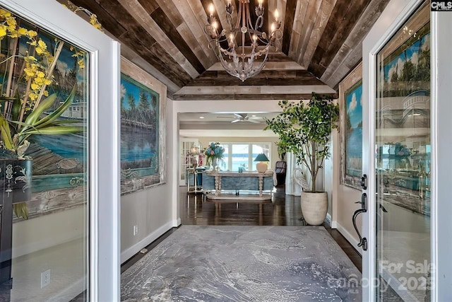 interior space featuring lofted ceiling, wooden ceiling, and an inviting chandelier