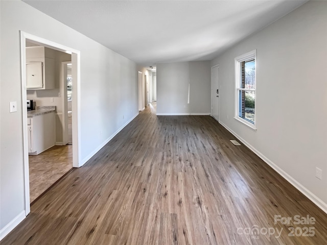 empty room with hardwood / wood-style floors