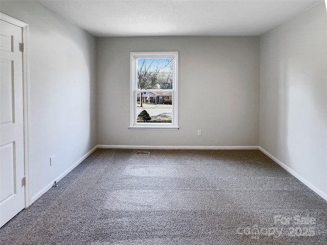 unfurnished room with carpet flooring