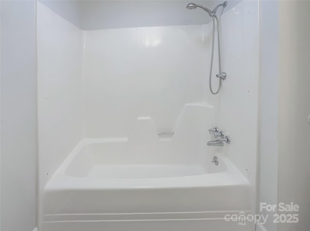 bathroom featuring washtub / shower combination