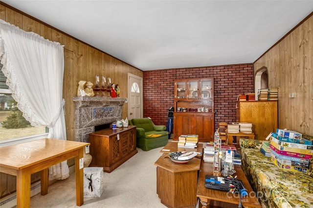 carpeted living room featuring wooden walls and a fireplace