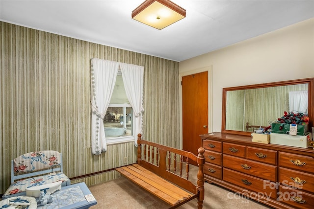 sitting room featuring light colored carpet