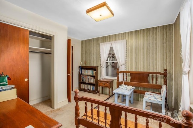 bedroom featuring a closet and light carpet