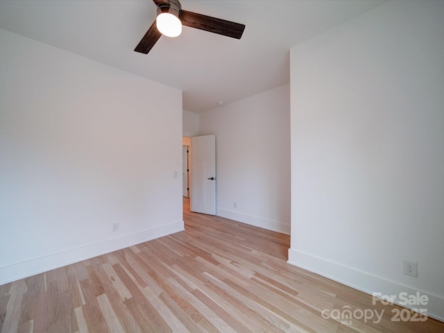 unfurnished room featuring ceiling fan and light wood-type flooring