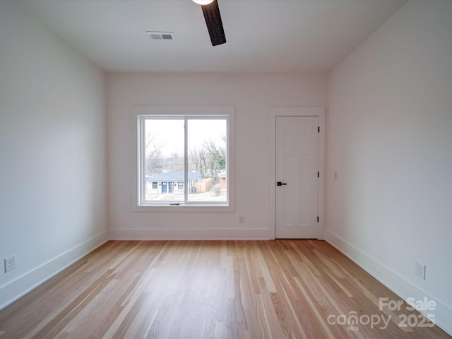 unfurnished room featuring ceiling fan and light hardwood / wood-style floors