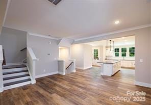 114 Glencoe Ln Unit 106, Mooresville, NC 28117 - unfurnished living room featuring crown molding, wood finished floors, and recessed lighting
