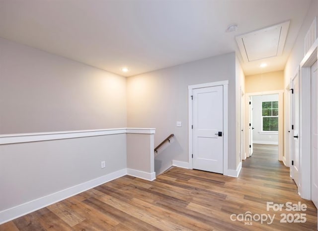 114 Glencoe Ln Unit 106, Mooresville, NC 28117 - spare room with attic access, wood finished floors, a smoke detector, and recessed lighting