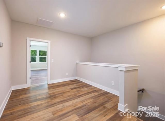 114 Glencoe Ln Unit 106, Mooresville, NC 28117 - unfurnished room featuring wood finished floors and recessed lighting