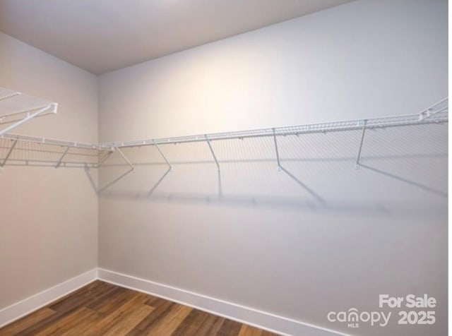 114 Glencoe Ln Unit 106, Mooresville, NC 28117 - spacious closet featuring dark wood finished floors