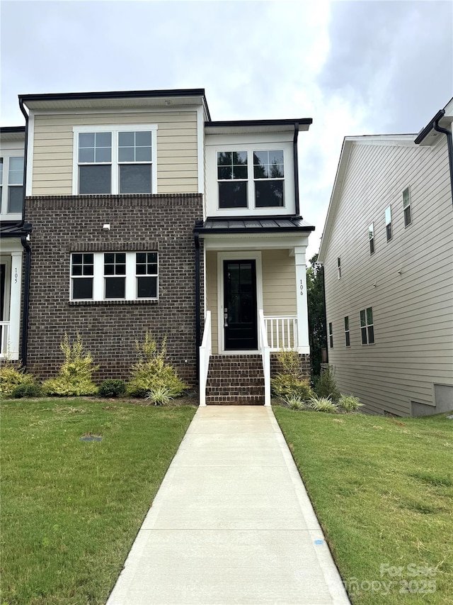 114 Glencoe Ln Unit 106, Mooresville, NC 28117 - view of front of property featuring brick siding and a front lawn