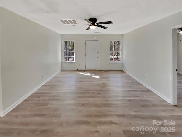 interior space featuring light wood-type flooring and ceiling fan