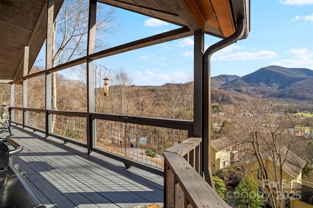 wooden deck featuring a mountain view