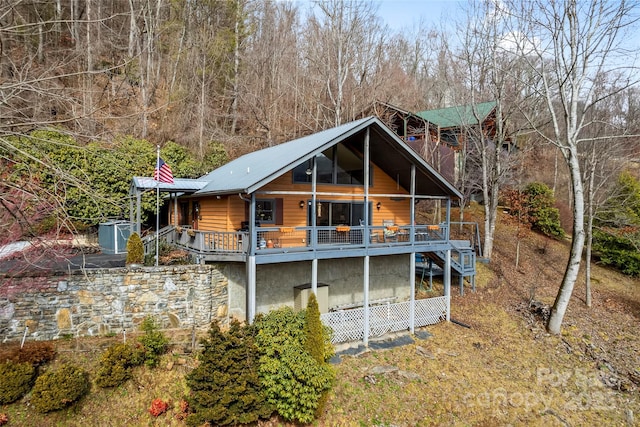 rear view of house with a deck