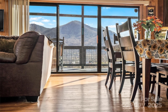 dining room with a mountain view and hardwood / wood-style floors