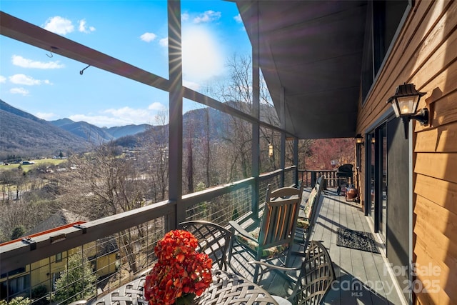 exterior space featuring a mountain view and a balcony