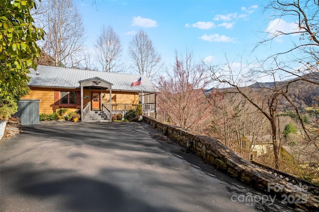 view of property exterior with a porch