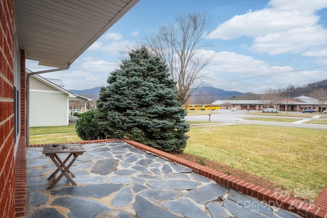 view of patio / terrace featuring a mountain view