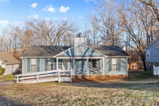 bungalow-style house with a porch and a front lawn