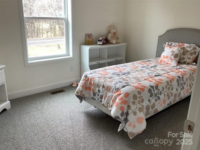 bedroom with dark carpet