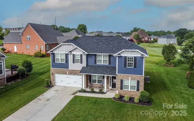 view of front of house with a garage and a front yard