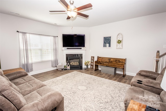 137 Tenth Green Ct, Statesville, NC 28677 - living room with a ceiling fan, baseboards, wood finished floors, and a tiled fireplace