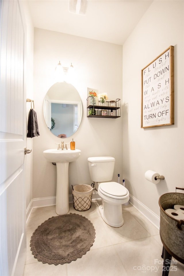137 Tenth Green Ct, Statesville, NC 28677 - half bathroom featuring toilet, baseboards, and tile patterned flooring