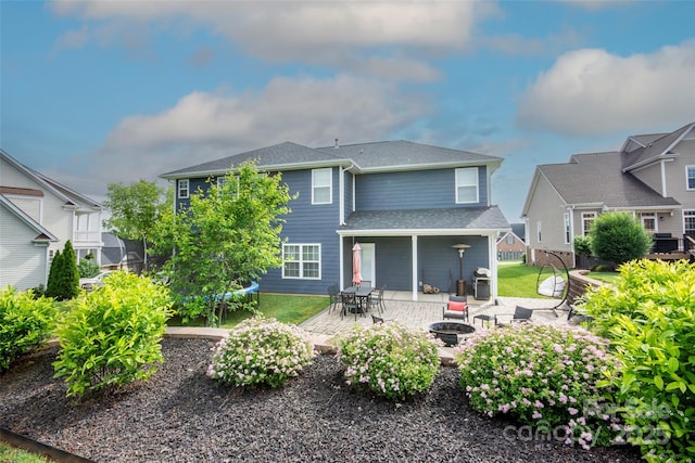 137 Tenth Green Ct, Statesville, NC 28677 - rear view of property with a fire pit and a patio