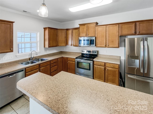 kitchen featuring light tile patterned floors, sink, crown molding, stainless steel appliances, and hanging light fixtures