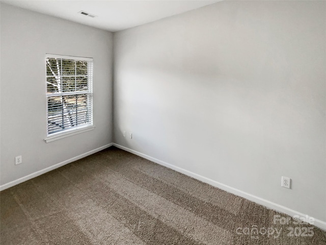 unfurnished room with carpet flooring