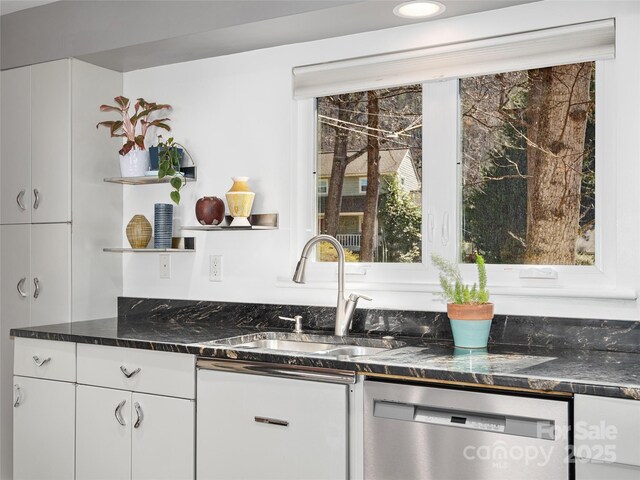 kitchen featuring a sink, white cabinetry, open shelves, and stainless steel dishwasher