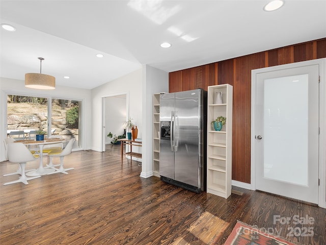 kitchen with recessed lighting, vaulted ceiling, stainless steel refrigerator with ice dispenser, dark wood finished floors, and pendant lighting