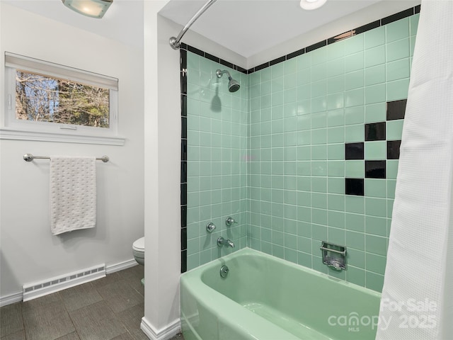 full bath with shower / tub combo, baseboards, baseboard heating, and toilet