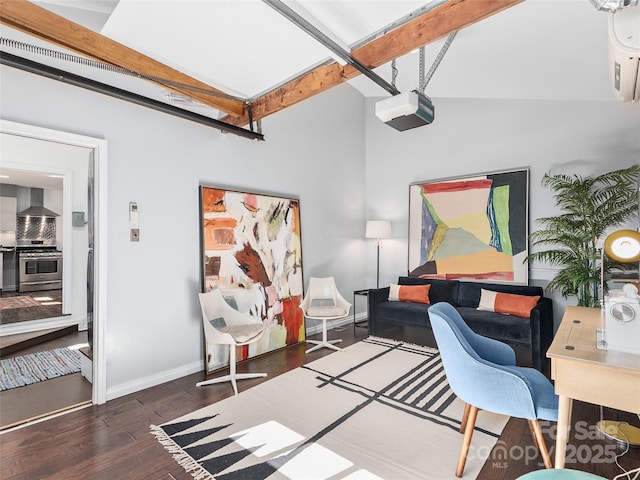 home office with lofted ceiling with beams, wood finished floors, and baseboards