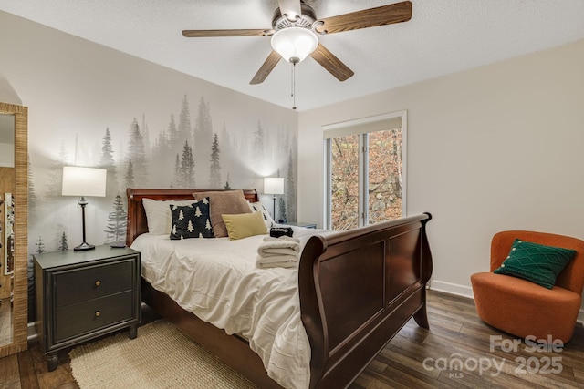 bedroom featuring a textured ceiling, dark wood-type flooring, a ceiling fan, and baseboards