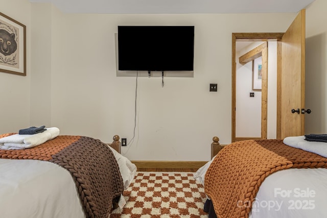 bedroom featuring baseboards