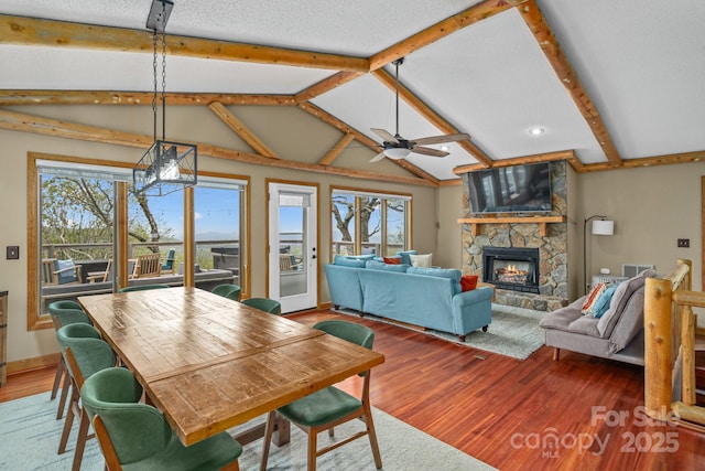 114 Spruce Hollow Rd, Beech Mountain, NC 28604 - dining room with plenty of natural light, a fireplace, a ceiling fan, wood finished floors, and recessed lighting
