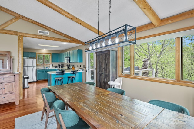 114 Spruce Hollow Rd, Beech Mountain, NC 28604 - dining space featuring wood finished floors and plenty of natural light