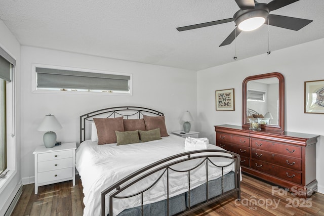 114 Spruce Hollow Rd, Beech Mountain, NC 28604 - bedroom with a baseboard heating unit, wood finished floors, and a ceiling fan