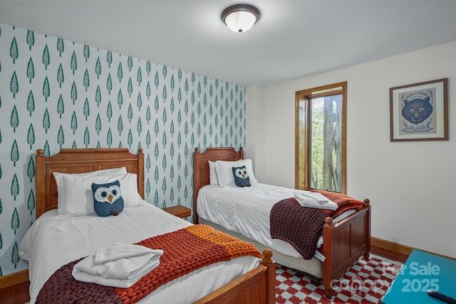 114 Spruce Hollow Rd, Beech Mountain, NC 28604 - bedroom with wood finished floors, wallpapered walls, and baseboards