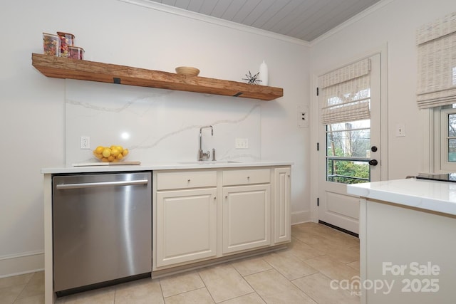 kitchen featuring sink, crown molding, dishwasher, white cabinetry, and tasteful backsplash