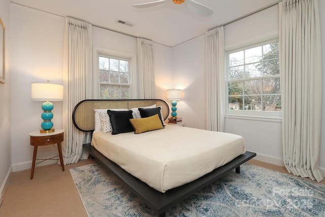 carpeted bedroom featuring ceiling fan