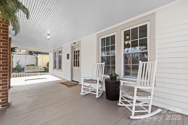 wooden terrace with a porch