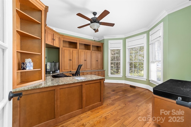 office area with ornamental molding, ceiling fan, and light wood-type flooring