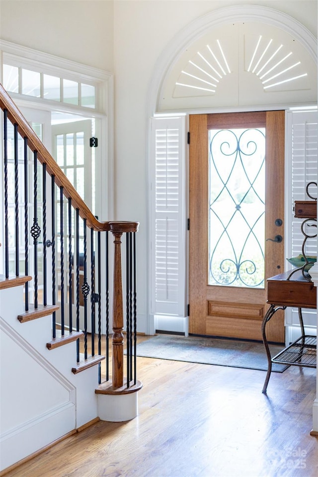 entryway with hardwood / wood-style floors