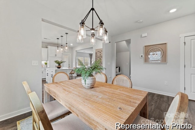 dining area with dark hardwood / wood-style flooring